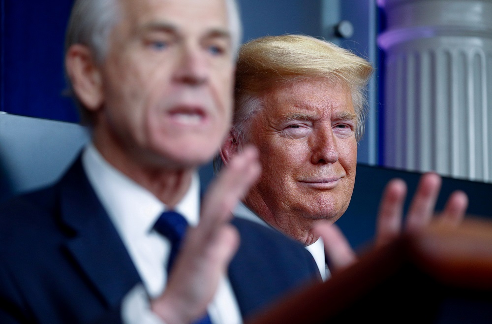 US President Donald Trump listens as White House Director of Trade and Marketing Policy Peter Navarro addresses the daily coronavirus response briefing at the White House in Washington April 2, 2020. u00e2u20acu201d Reuters pic