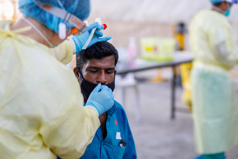 Swab tests are conducted at STLodge migrant workersu00e2u20acu2122 dormitory during the Covid-19 outbreak in Singapore, in this April 15, 2020 photo obtained via social media. u00e2u20acu201d Picture by Singapore Ministry of Manpower via Reuters