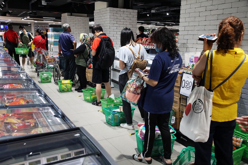 A queue at the NTUC FairPrice outlet in Woodlands Civic Centre at about 6.30pm on April 3, 2020. u00e2u20acu201d TODAY pic