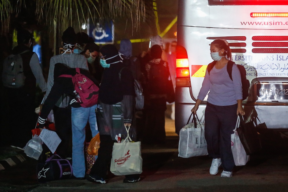 The first batch of university students arrive at the Northern Seberang Perai Land and District Office, Bukit Mertajam on a bus April 28, 2020. u00e2u20acu201d Picture by Sayuti Zainudin