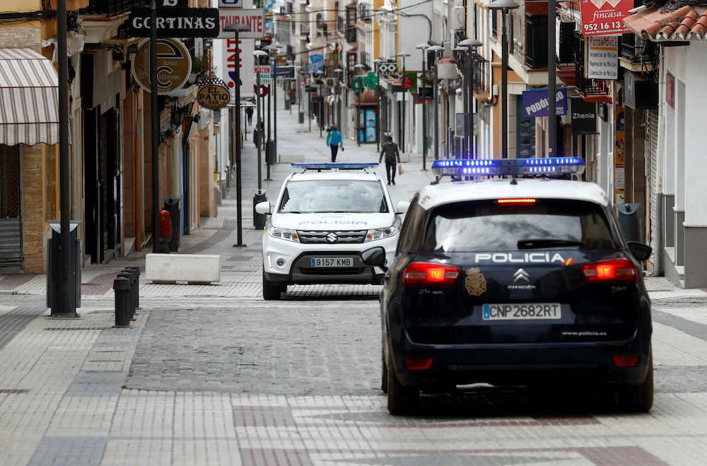 Patrol cars of local police and Spanish National police are seen in the empty shopping La Bola street during the lockdown amid the coronavirus disease (Covid-19) outbreak in Ronda, southern Spain April 20, 2020. u00e2u20acu201d Reuters pic
