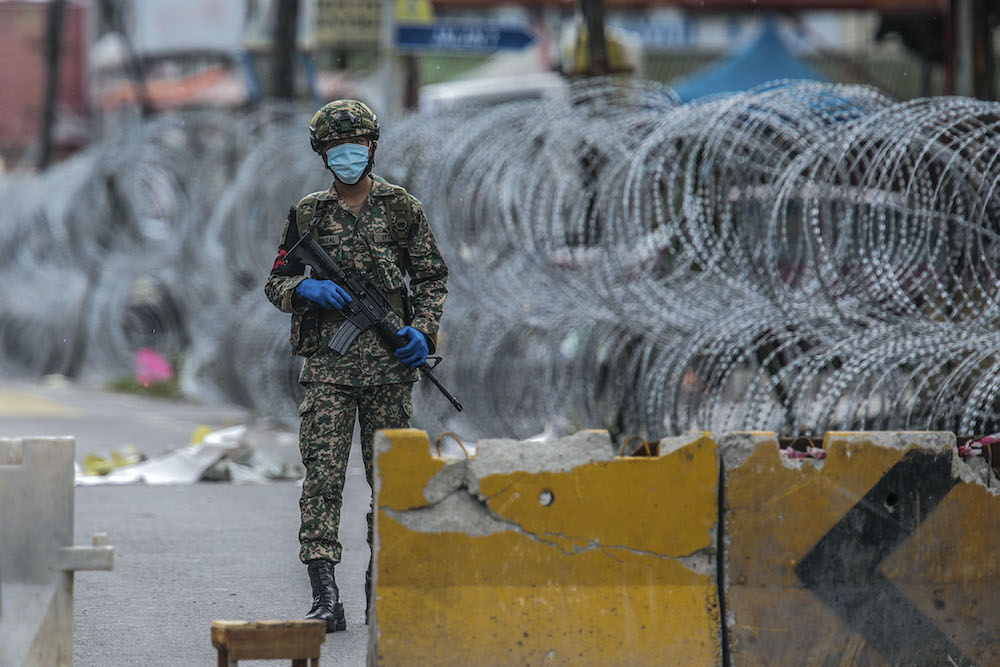 Members of the Malaysian Armed Forces patrol Selayang Baru during the enhanced movement control order (EMCO), April 25, 2020. u00e2u20acu201d Picture by Hari Anggara