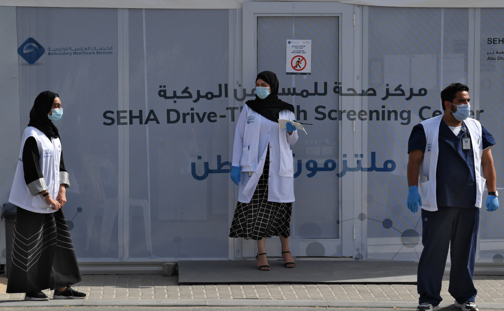 Medical volunteers wait outside a drive-through Covid-19 coronavirus testing centre in al-Khawaneej district of the gulf emirate of Dubai April 9, 2020. u00e2u20acu201d AFP pic 