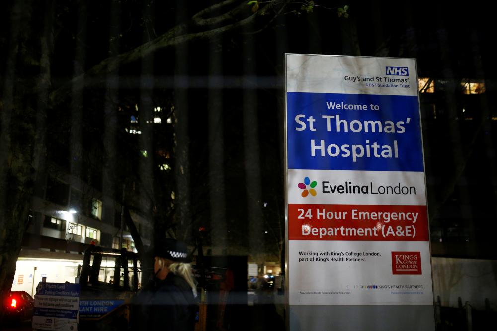 A police officer is seen in the St Thomas' Hospital after British Prime Minister Boris Johnson was moved to intensive care after his Covid-19 symptoms worsened, April 6, 2020. u00e2u20acu2022 Reuters pic