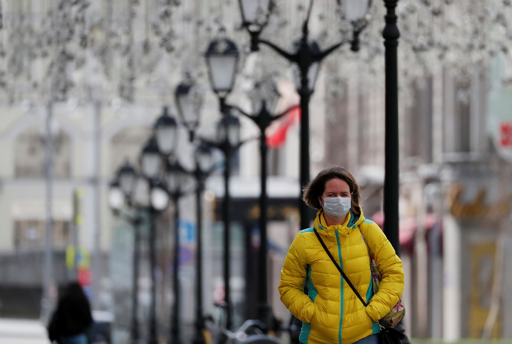 A woman wearing a protective face mask walks along the street, as the spread of the coronavirus disease continues, in Moscow April 10, 2020. u00e2u20acu2022 Reuters pic