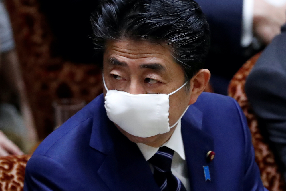 Japanu00e2u20acu2122s Prime Minister Shinzo Abe wears a protective face mask as he attends an upper house parliamentary session, following an outbreak of the coronavirus disease (Covid-19), in Tokyo, Japan April 1, 2020. u00e2u20acu201d Reuters pic