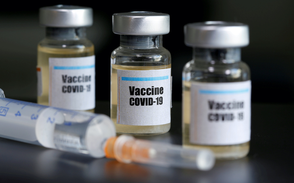 Small bottles labelled with a u00e2u20acu02dcVaccineCovid-19 sticker and a medical syringe are seen in this illustration taken April 10, 2020. u00e2u20acu201d Reuters picnn