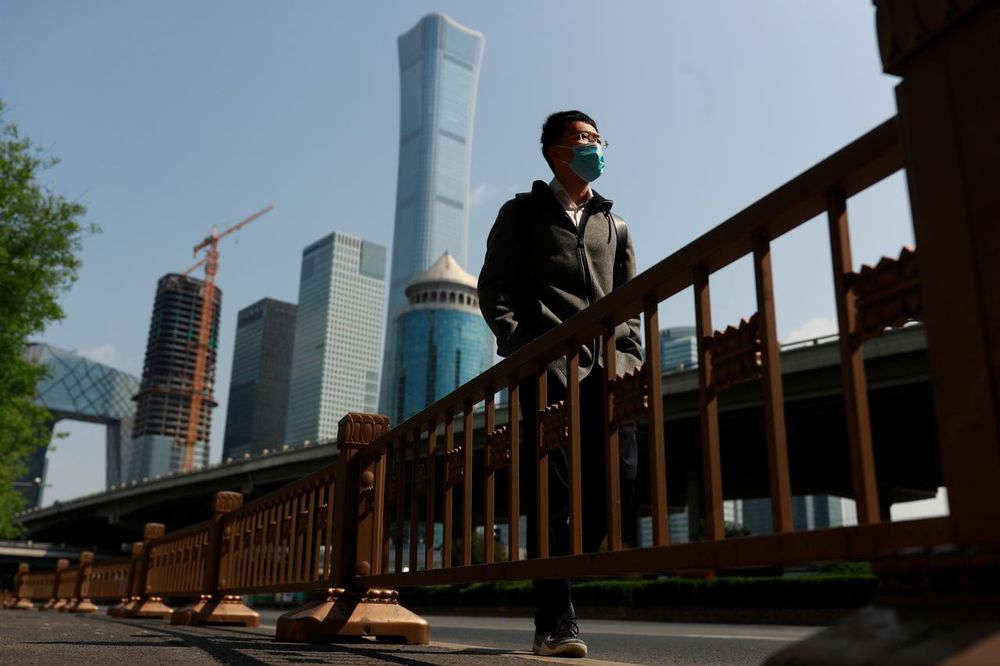 A walks by Beijingu00e2u20acu2122s Central Business District during morning rush hour as the spread of the new coronavirus disease (Covid-19) continues in China, April 17, 2020. u00e2u20acu201d Reuters pic