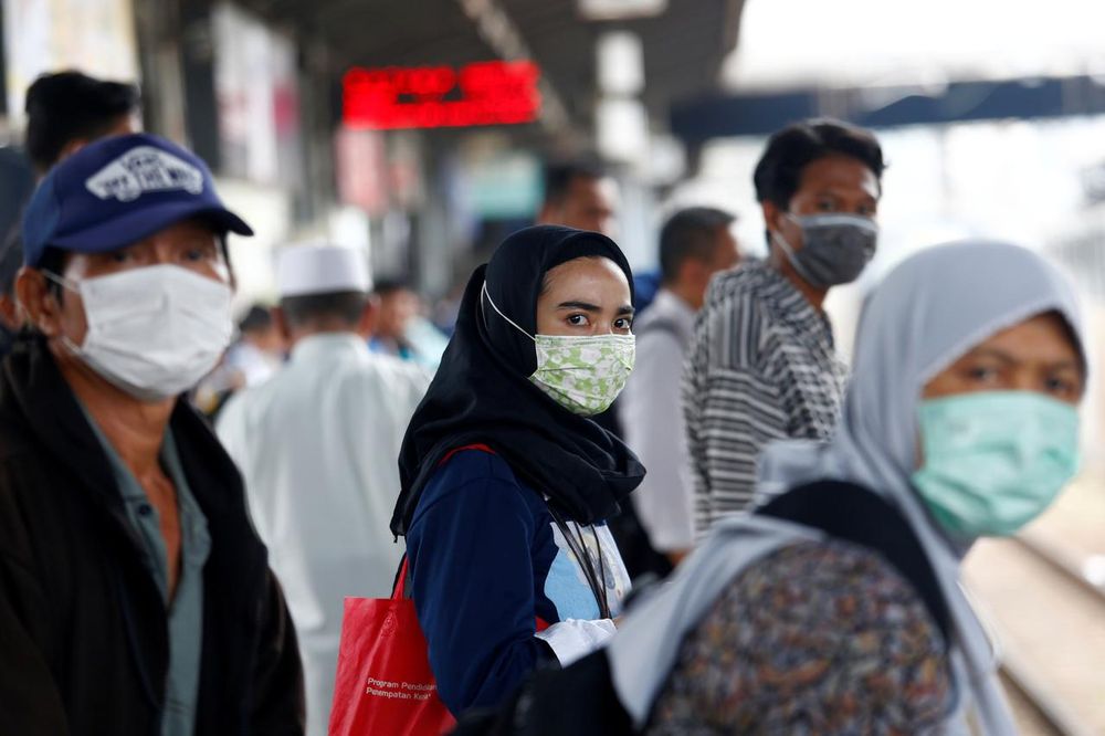 People with surgical masks look on at station Tanah Abang, following the outbreak of the coronavirus , in Jakarta, Indonesia, February 13, 2020. u00e2u20acu201d Reuters pic