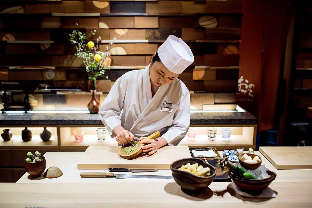 Mizuho Iwai, an apprentice at Sushi Ginza Onodera restaurant, grinds wasabi at the restaurant in Tokyo, January 16, 2020. u00e2u20acu201d AFP pic