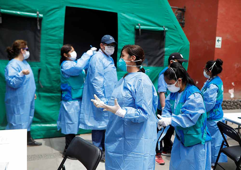 Public health workers prepare to give medical examinations at the Plaza de Acho bullring as part of response to the spread of Covid-19, in Lima, Peru March 31, 2020.  u00e2u20acu201d Reuters pic