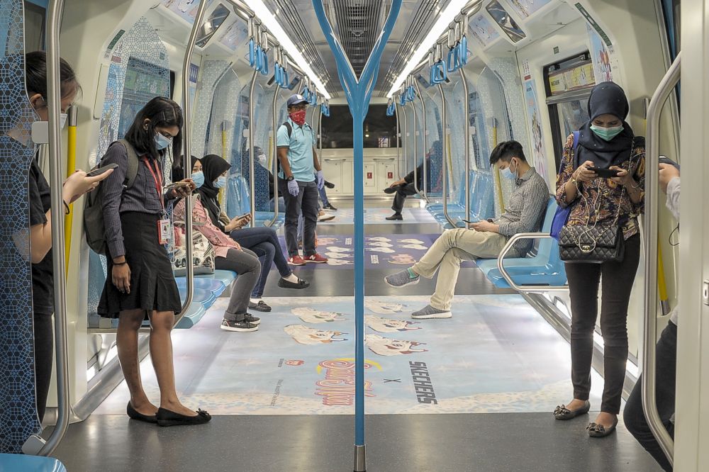 MRT commuters observe social distancing aboard a train in Kuala Lumpur April 30, 2020. u00e2u20acu201d Picture by Shafwan Zaidon