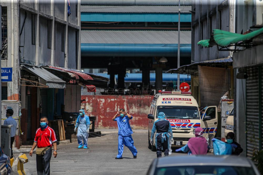 Health workers are pictured at the Selayang wholesale market in Kuala Lumpur April 21, 2020. u00e2u20acu201d Picture by Hari Anggara