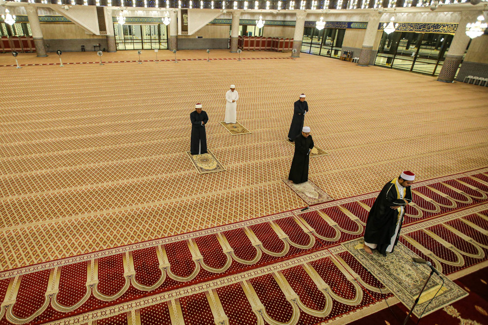 The National Mosqueu00e2u20acu2122s invited Islamic scholar, Ustaz Ahmad Mujahid Salleh Sani (right) officiated the tarawih prayer with four National Mosque staff April 23, 2020. u00e2u20acu201d Picture by Hari Anggara