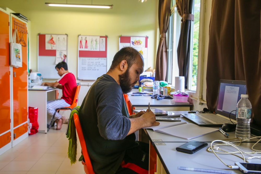 Universiti Teknologi Mara students study in their dormitory room during the third phase of the movement control order in Shah Alam April 22, 2020. u00e2u20acu201d Picture by Yusof Mat Isa