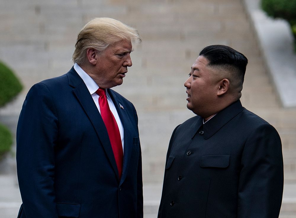 In this file photo taken on June 30, 2019, US President Donald Trump and North Koreau00e2u20acu2122s leader Kim Jong-un stand on North Korean soil while walking to South Korea in the Demilitarized Zone(DMZ), in Panmunjom, Korea. u00e2u20acu201d AFP pic