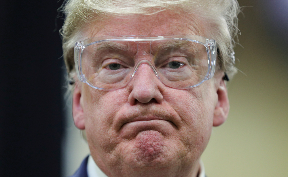 US President Donald Trump watches workers on the assembly line manufacturing protective masks for the coronavirus disease (Covid-19) outbreak during a tour of a Honeywell manufacturing facility in Phoenix, Arizona May 5, 2020. u00e2u20acu201d Reuters pic