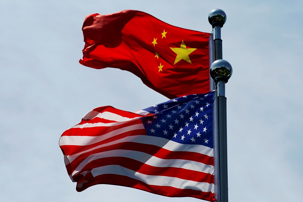 Chinese and US flags flutter near The Bund, before US trade delegation meet their Chinese counterparts for talks in Shanghai July 30, 2019. u00e2u20acu201d Reuters pic