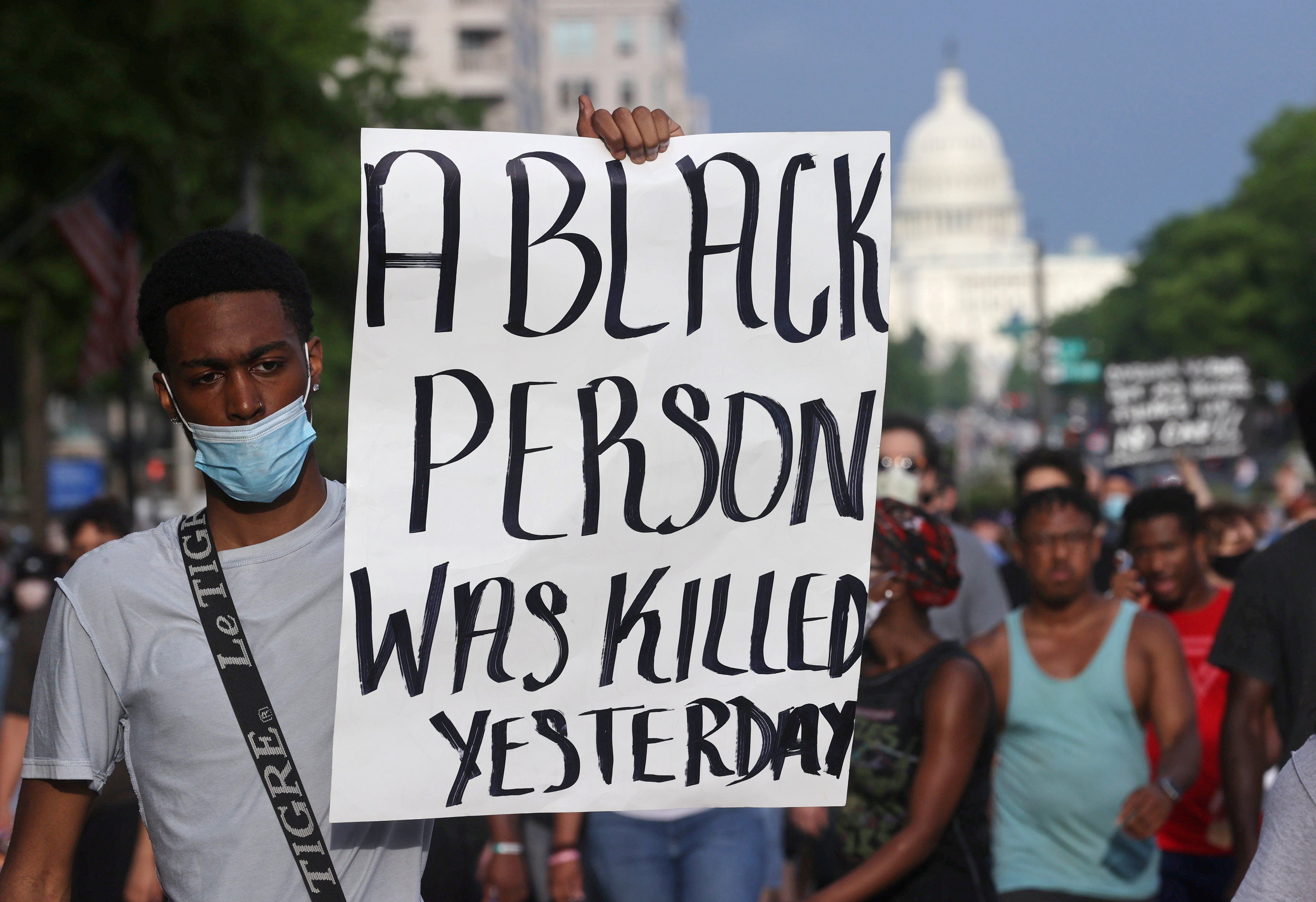 A protester holds a sign as he attends a protest near the White House during a rally and march against the death in Minneapolis police custody of African-American man George Floyd, in Washington May 29, 2020. u00e2u20acu201d Reuters pic