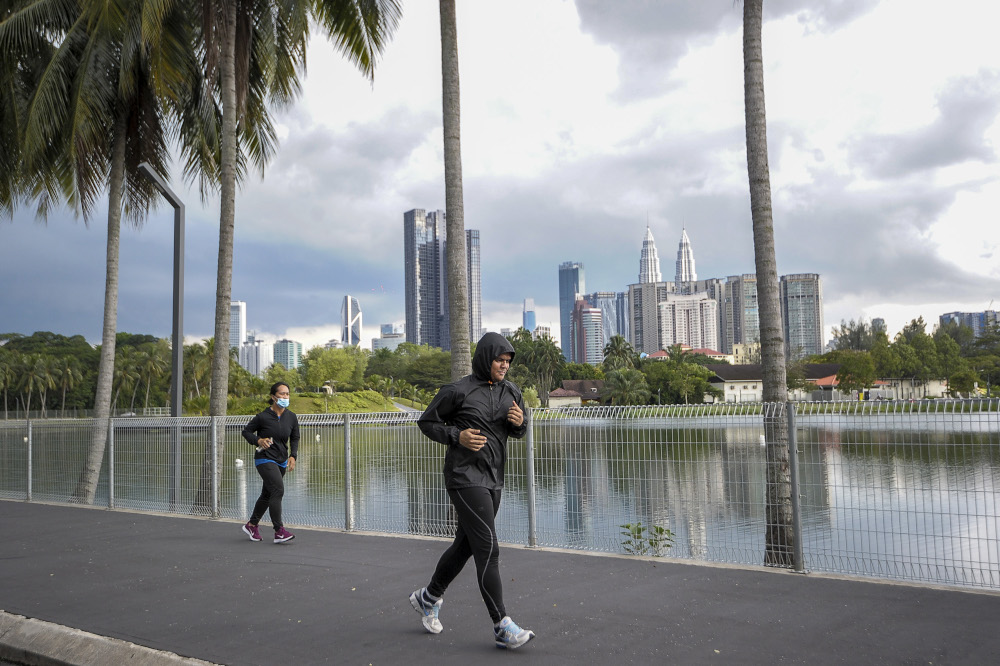 A view of people jogging at the Titiwangsa lake park in Kuala Lumpur May 4, 2020. u00e2u20acu201d Picture by Shafwan Zaidon