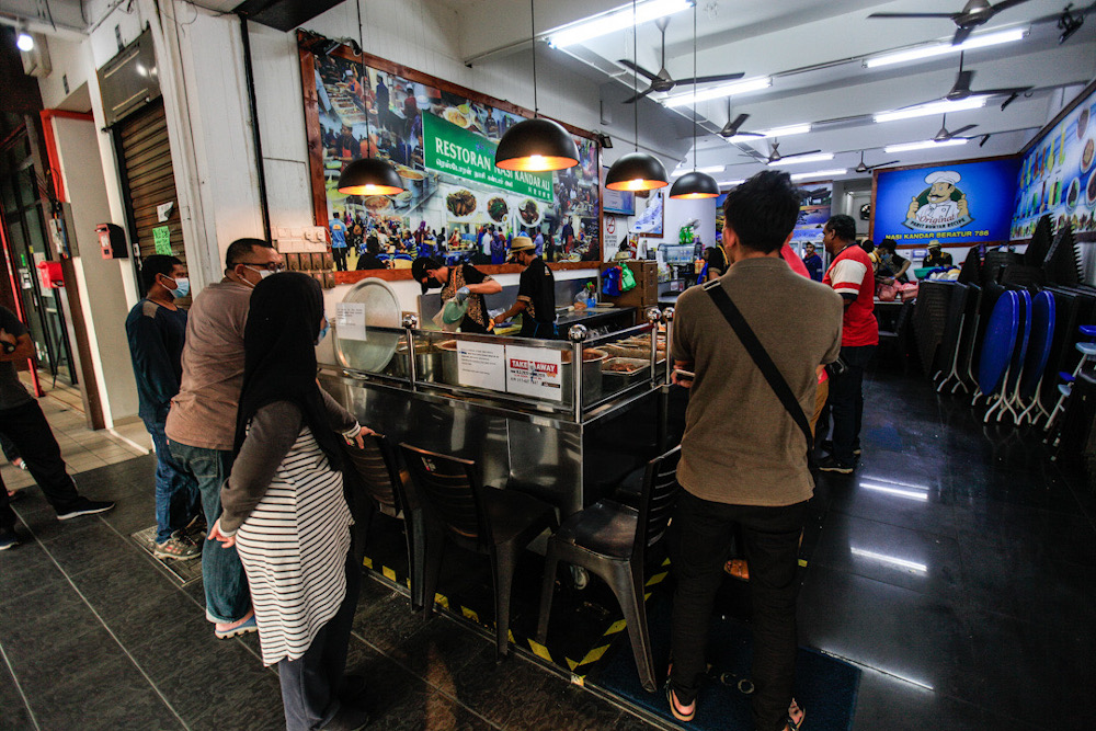 Customers queue for takeaway at Restoran Nasi Kandar Ali , Jalan Todak, Penang on May 5, 2020. u00e2u20acu201d Picture by Sayuti Zainudin