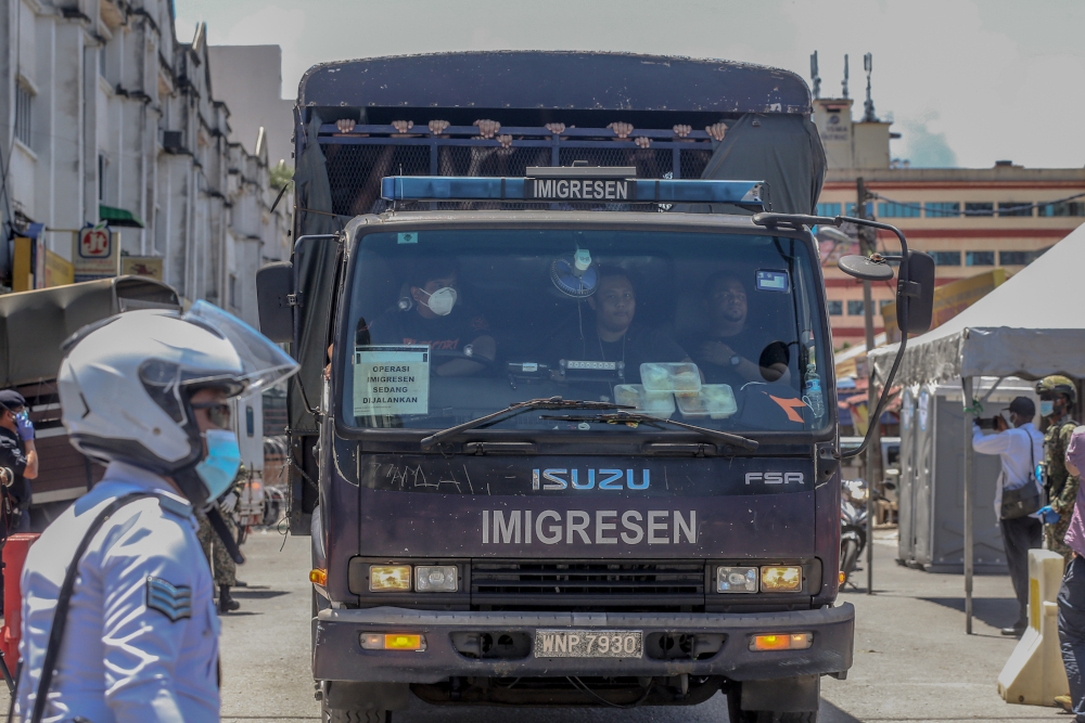 An Immigration Department truck is seen following raids against undocumented migrants carried out at Selayang Baru in Kuala Lumpur May 14, 2020. u00e2u20acu201d Picture by Yusof Mat Isa
