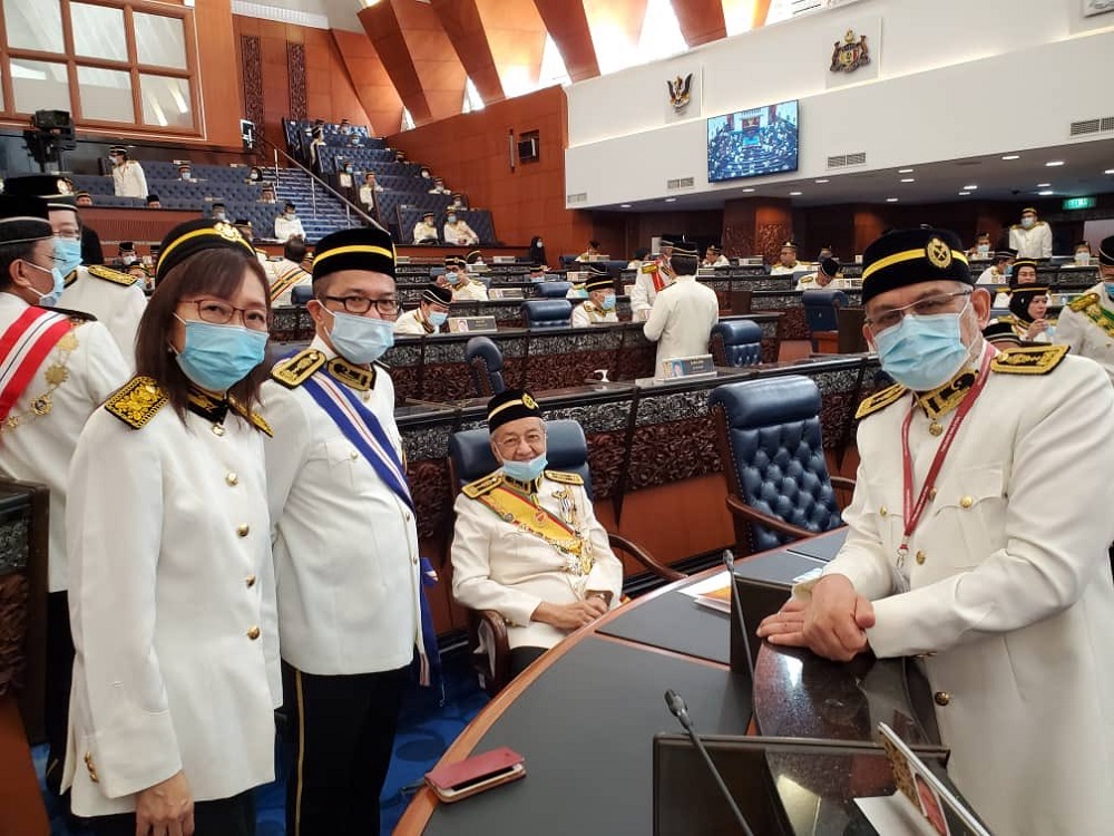 Langkawi MP Tun Dr Mahathir Mohamad (seated) with opposition MPs during the official opening of the Third Session of the 14th Parliament in Kuala Lumpur May 18, 2020. u00e2u20acu201d Picture via Twitter/NoorAminAhmadn