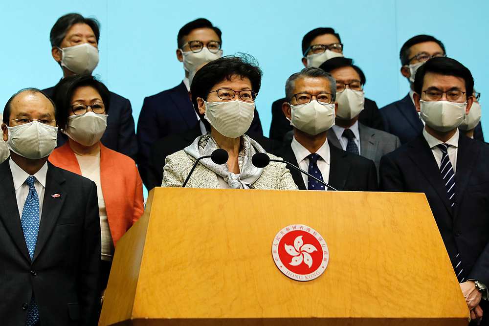 Hong Kong Chief Executive Carrie Lam (front) attends a news conference with officers over Beijingu00e2u20acu2122s plans to impose national security legislation in Hong Kong May 22, 2020. u00e2u20acu201d Reuters pic