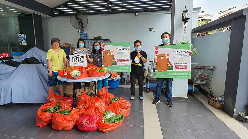 Erik Ong (right) and his team distributing packs of daily essentials to Rumah Charis in Kuala Lumpur. u00e2u20acu201d Picture courtesy of Erik Ong  