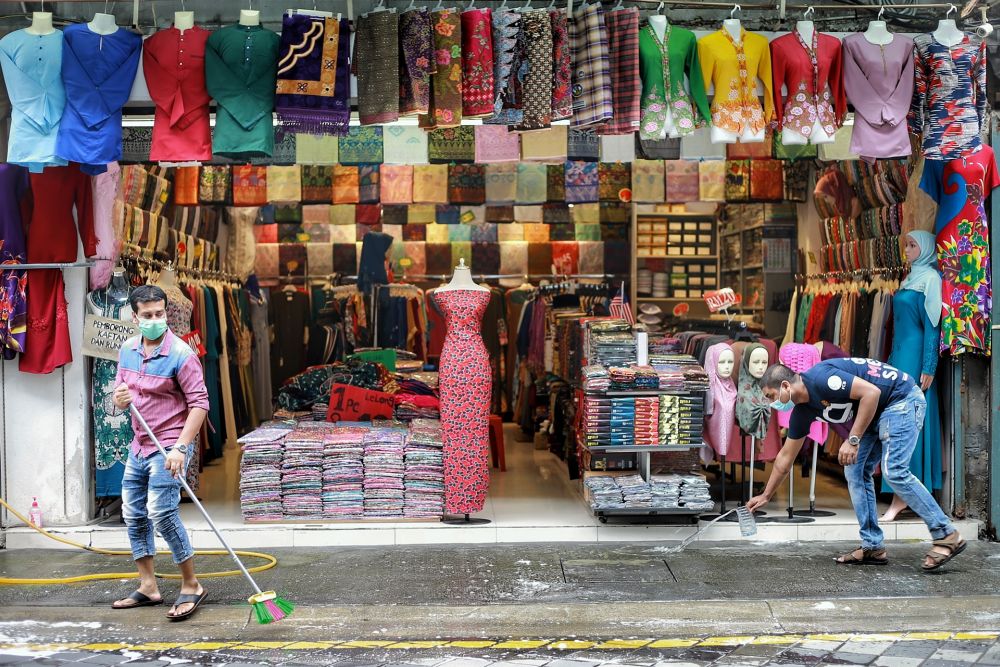A fabric store opens for business on Jalan Masjid India amid the conditional movement control order in Kuala Lumpur May 7, 2020. u00e2u20acu201d Picture by Ahmad Zamzahuri