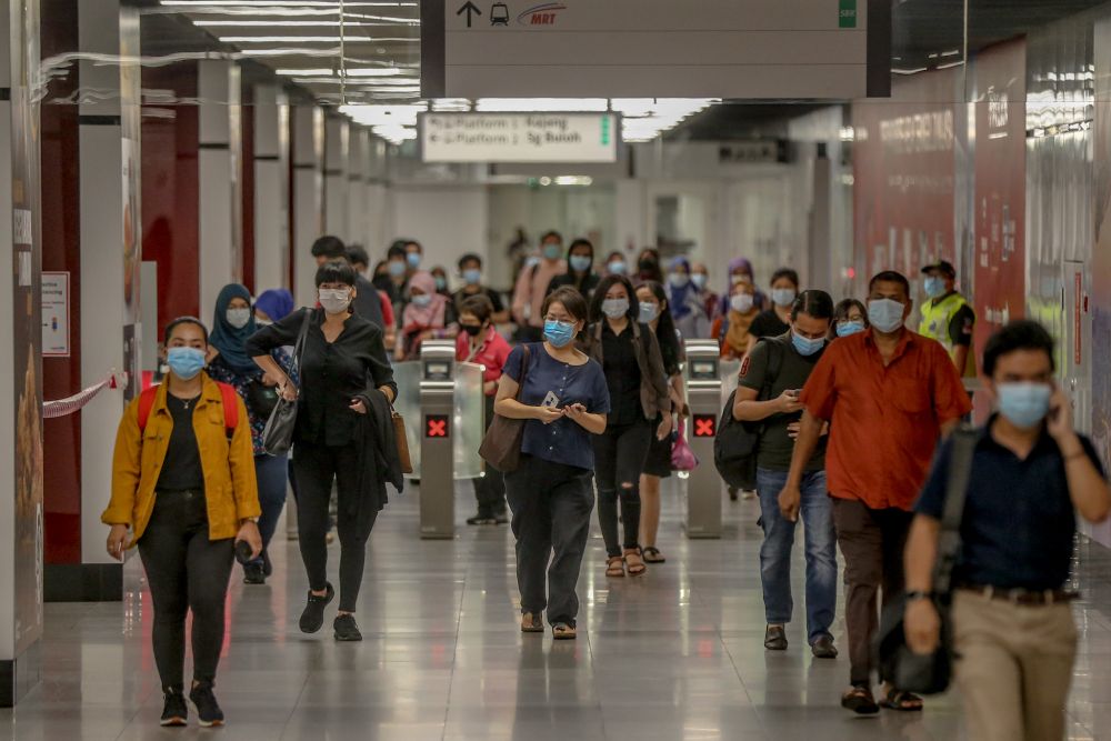 Commuters throng the Maluri MRT station on first day of the conditional movement control order in Kuala Lumpur May 4, 2020. u00e2u20acu201d Picture by Firdaus Latif