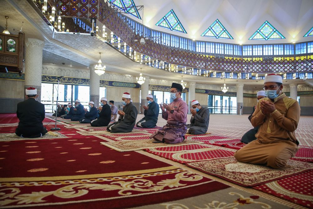 Muslims return to the National Mosque for Friday prayers in Kuala Lumpur May 15, 2020. u00e2u20acu201d Picture by Yusof Mat Isa