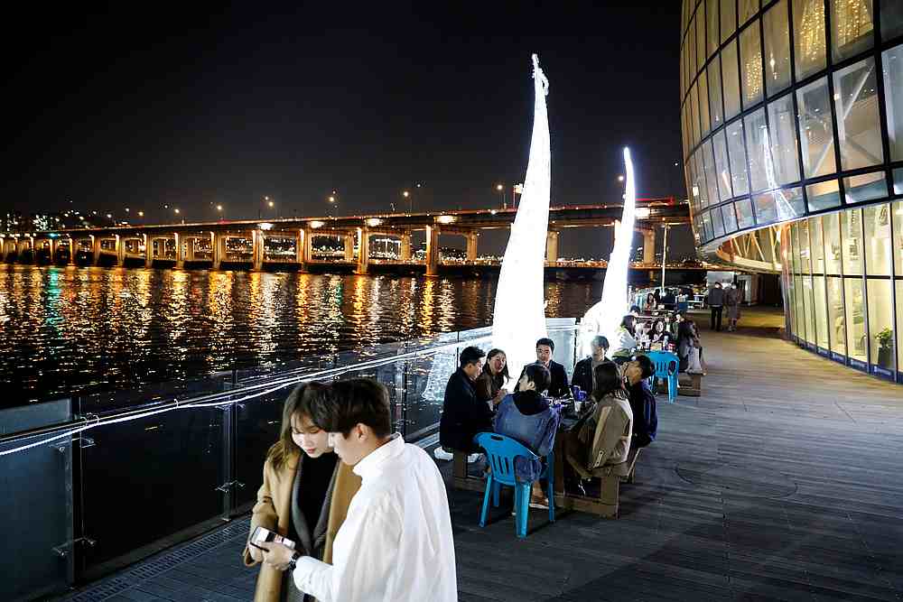 People enjoy drinks amid concerns about the spread of Covid-19, at Han River park in Seoul, South Korea April 29, 2020. u00e2u20acu201d Reuters pic
