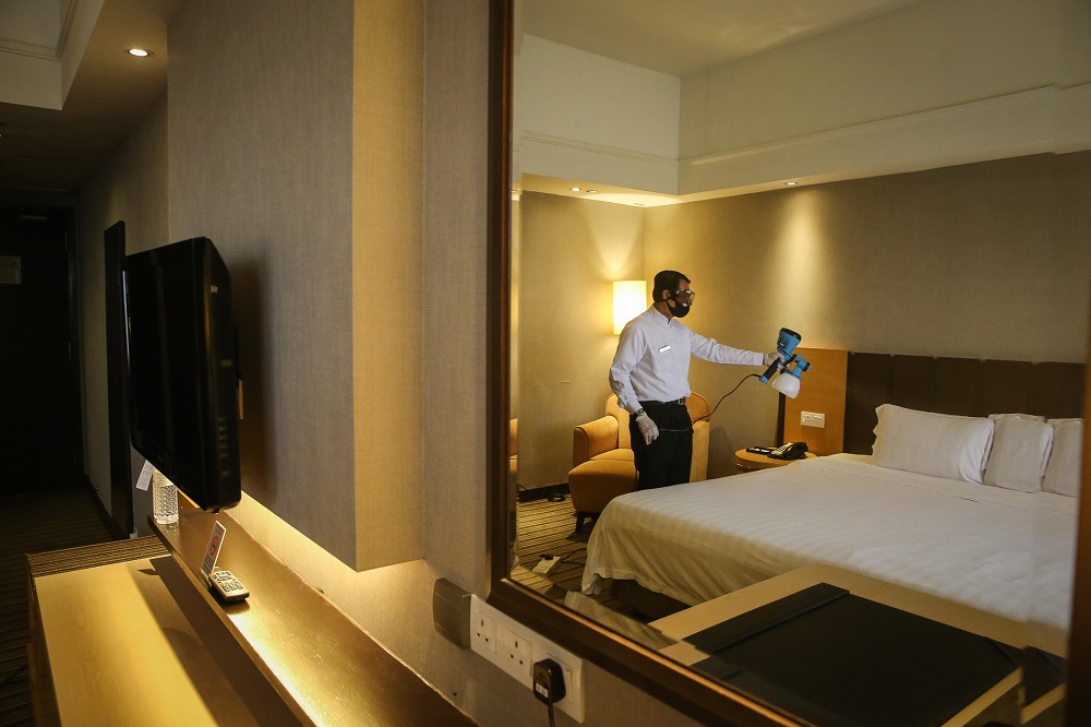 A hotel employee disinfects one of the rooms at the Concorde Hotel in Shah Alam June 9, 2020. u00e2u20acu201d Picture by Yusof Mat Isa