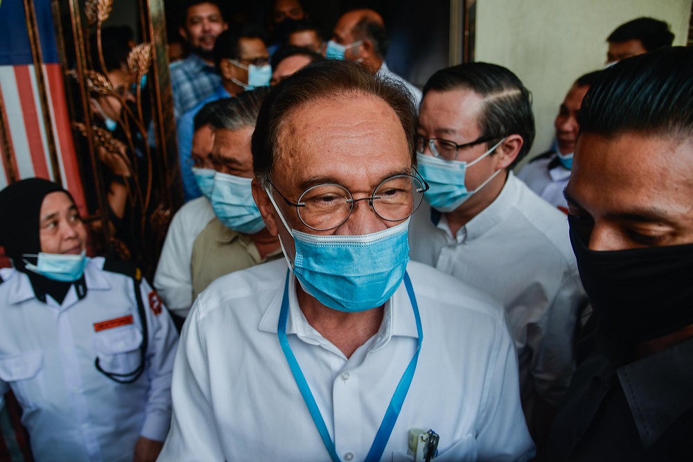 PKR president Datuk Seri Anwar Ibrahim leaves the party's headquarters following a four-hour meeting with other Pakatan leaders, in Petaling Jaya June 9, 2020. u00e2u20acu201d Picture by Hari Anggara