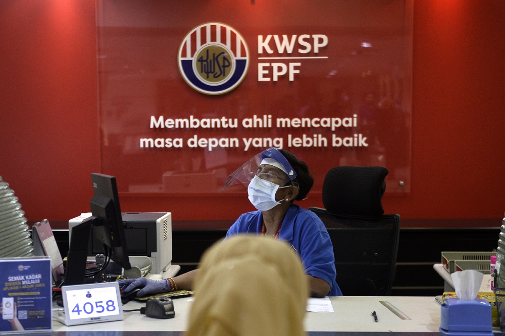 General view of staff in protective gear as they work at the Employees Provident Fundu00e2u20acu2122s headquarters in Kuala Lumpur June 12, 2020. u00e2u20acu201d Picture by Miera Zulyana