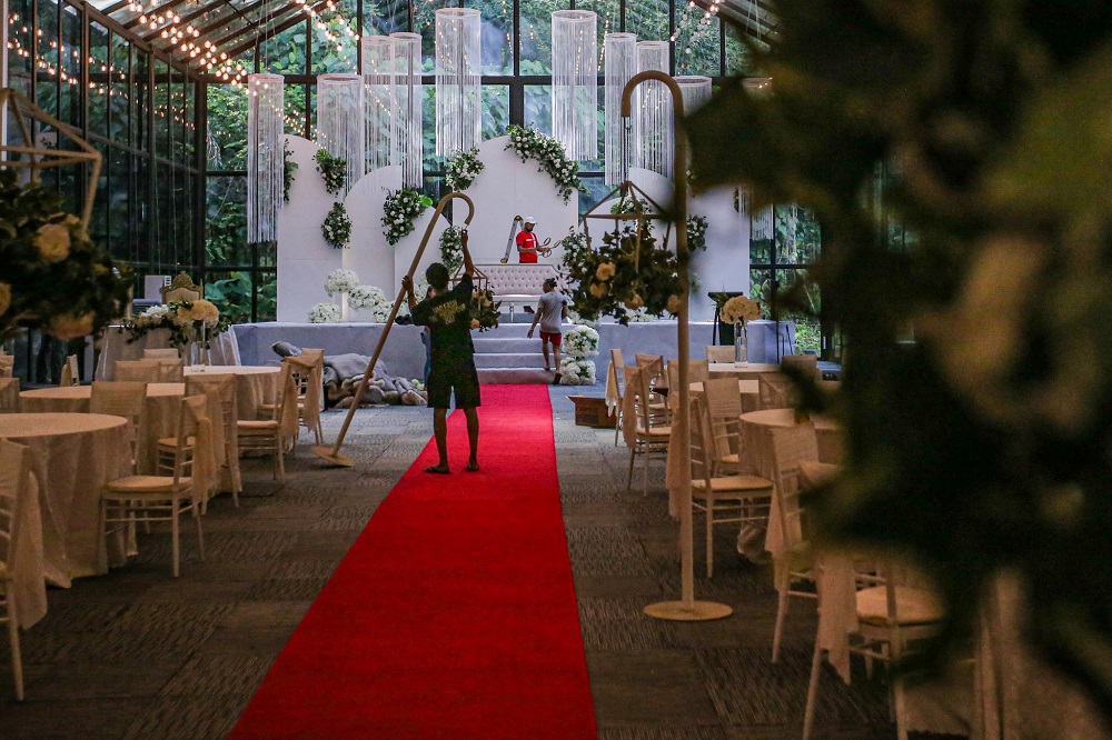 Staff members are seen decorating the Forest Valley wedding hall in Bandar Mahkota Cheras June 25, 2020. u00e2u20acu201d Picture by Hari Anggara