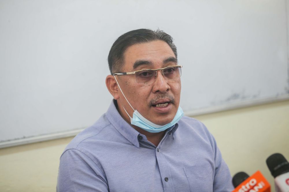 Deputy Education Minister Muslimin Yahaya speaks to reporters during a press conference at Sekolah Menengah Kebangsaan Raja Permaisuri Bainun in Ipoh June 9, 2020. u00e2u20acu201d Picture by Farhan Najib