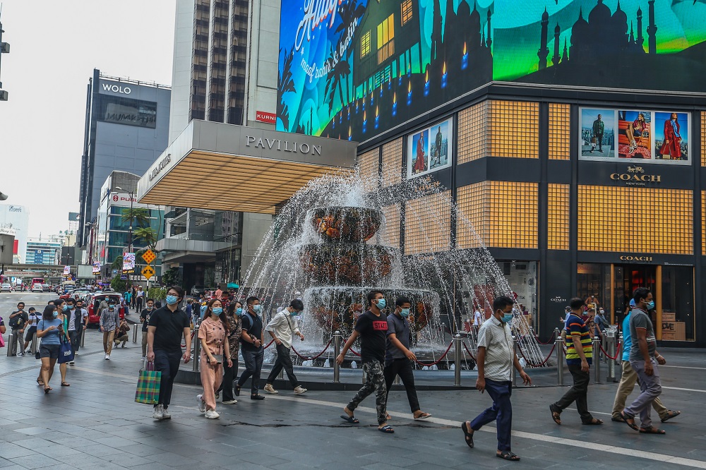 People are seen wearing protective masks as they walk along the Bukit Bintang shopping area in Kuala Lumpur May 31, 2020. u00e2u20acu2022 Picture by Firdaus Latif
