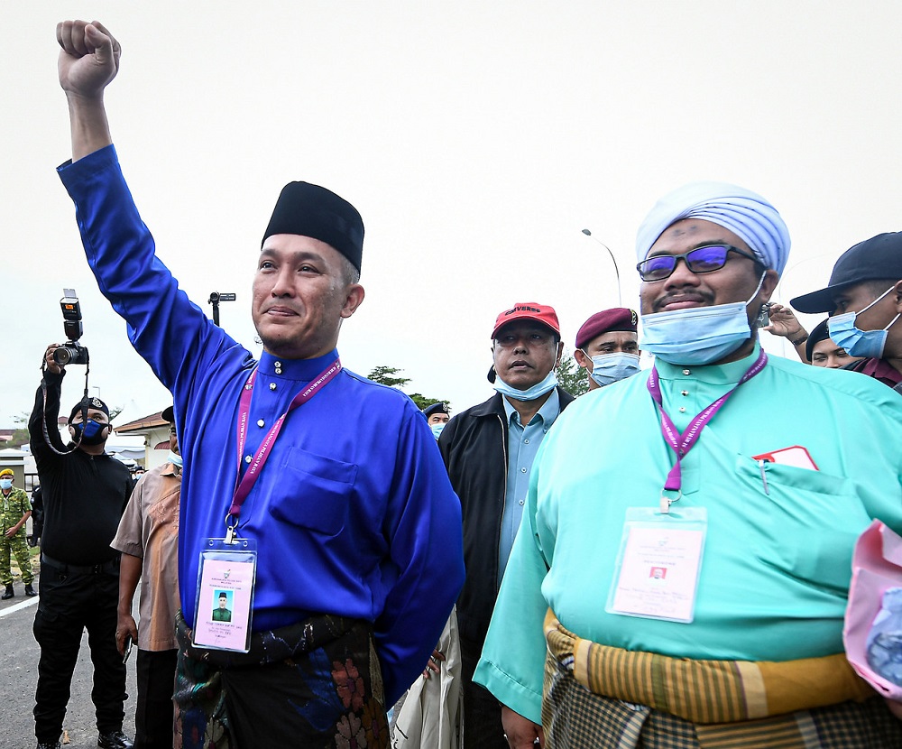 Barisan Nasional candidate Mohd Sharim Md Zain (left) arrives at the nomination centre in Pekan June 20, 2020. u00e2u20acu2022 Bernama pic