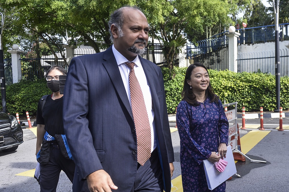 Segambut MP Hannah Yeoh and lawyer Gobind singh Deo arrive at Bukit Aman police headquarters in Kuala Lumpur June 23, 2020. u00e2u20acu2022 Picture by Miera Zulyana