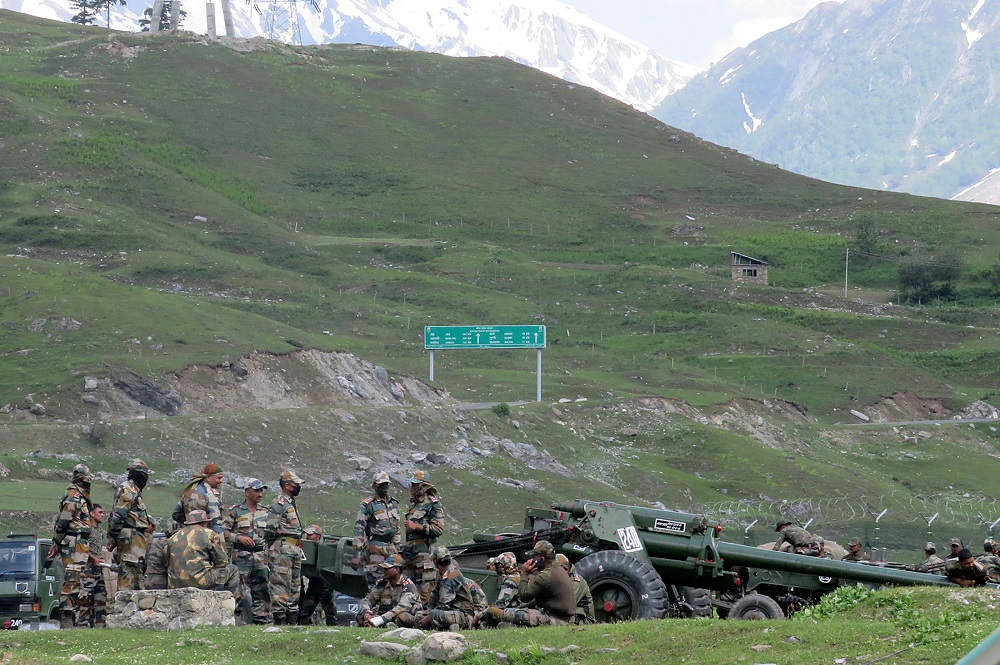 Indian army soldiers rest next to artillery guns at a makeshift transit camp before heading to Ladakh, near Baltal, southeast of Srinagar, June 16, 2020. u00e2u20acu2022 Reuters pic