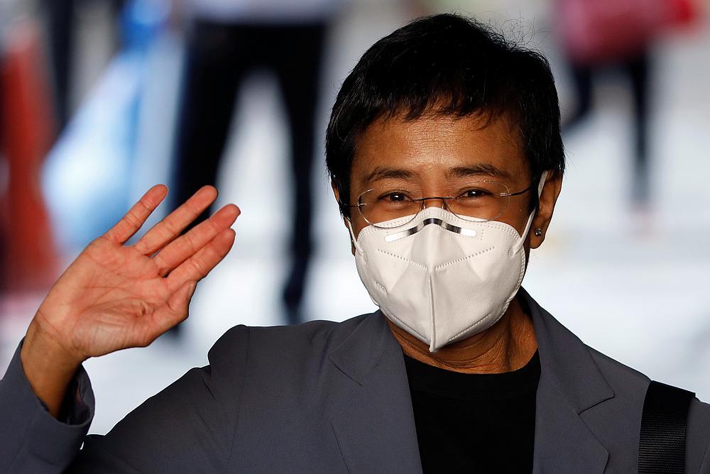 Maria Ressa, Executive Editor and CEO of Philippine news website Rappler, goes through a disinfection booth at the Manila Regional Trial Court, Philippines June 15, 2020.  u00e2u20acu201d Reuters pic