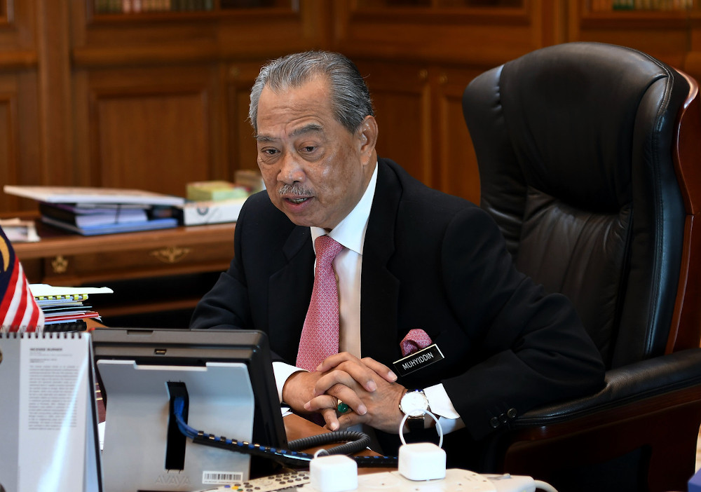 Prime Minister Tan Sri Muhyiddin Yassin speaking during a call with Singapore Prime Minister Lee Hsien Loong at his office in Putrajaya June 26, 2020. u00e2u20acu201d Bernama pic 