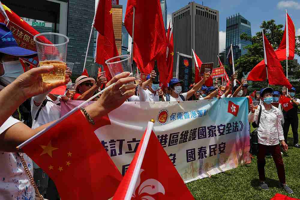 Pro-China supporters celebrate with champagne after China's parliament passes national security law for Hong Kong, in Hong Kong June 30, 2020. u00e2u20acu201d Reuters pic
