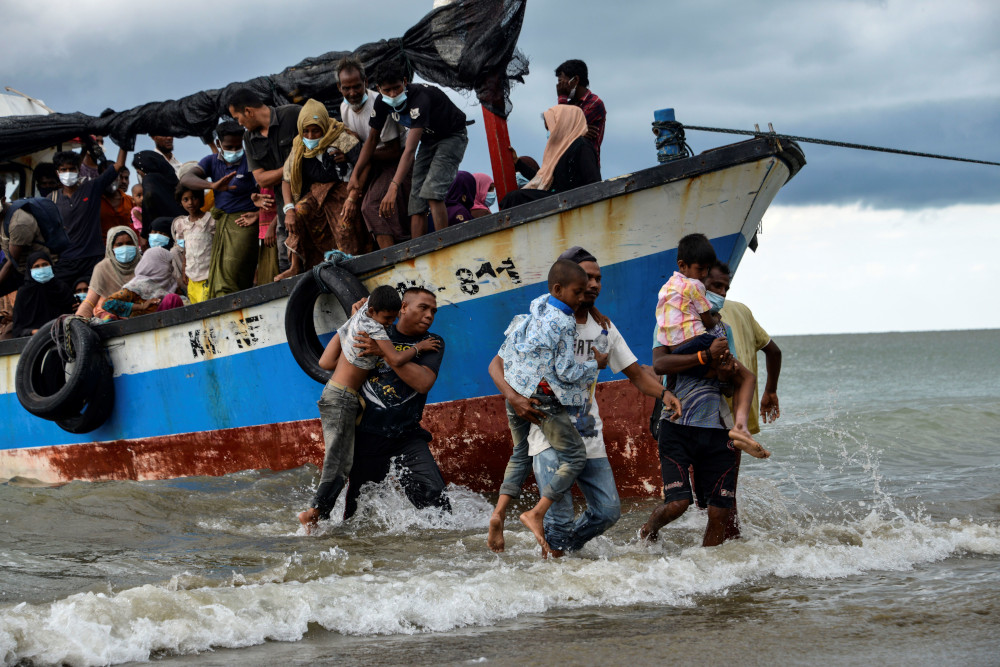 Acehnese fishermen help evacuate Rohingya children from Myanmar onto the shorelines of Lancok village, in Indonesiau00e2u20acu2122s North Aceh Regency June 25, 2020. u00e2u20acu201d AFP pic 