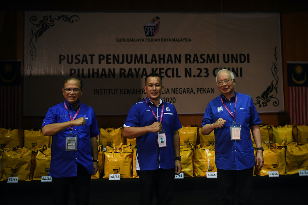 Barisan Nasional candidate Mohd Sharim Md Zain with Pahang Mentri Besar Datuk Seri Wan Rosdy Wan Ismail and Pekan MP Datuk Seri Najib Tun Razak after winning the Chini state by-election, July 4, 2020. u00e2u20acu201d Bernama pic