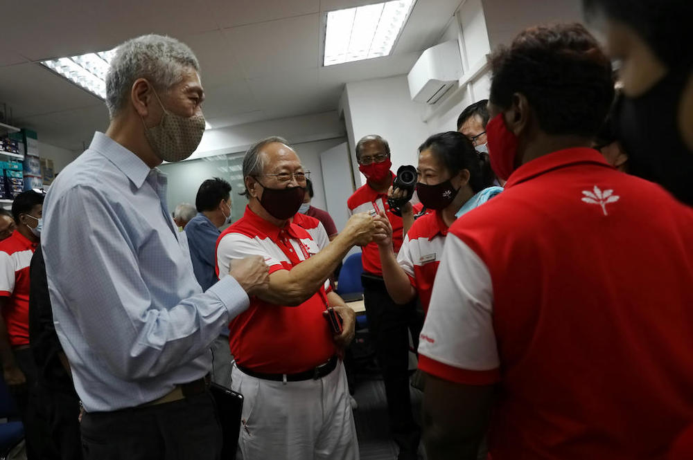 Dr Tan Cheng Bock (second from left) and other Progress Singapore Party members gather at the partyu00e2u20acu2122s headquarters after the election results were announced in the early hours of July 11, 2020. u00e2u20acu201d TODAY pic