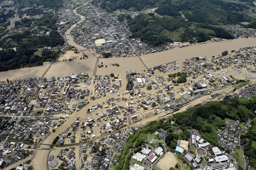 An aerial view shows flooded Kuma River caused by heavy rain at a residential area in Hitoyoshi, Kumamoto prefecture, southern Japan July 4, 2020. u00e2u20acu201d Picture by Kyodo via Reuters