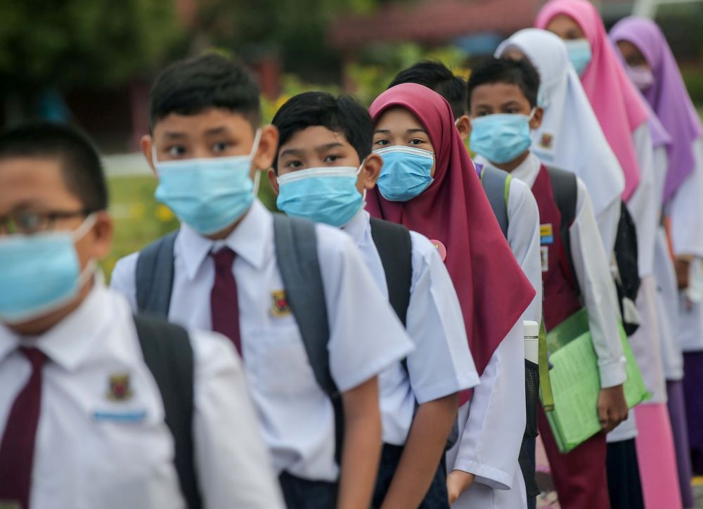 Sekolah Kebangsaan Jelapang students on their first day back at school in Ipoh July 15, 2020. u00e2u20acu201d Picture by Farhan Najib
